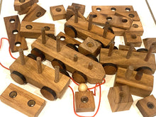 Load image into Gallery viewer, Pull along wooden train with 26 Piece, educational shapes jig-saw wooden toy.