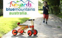 Load image into Gallery viewer, Ride on four wheeled wooden push bike on rubber wheels for toddlers.
