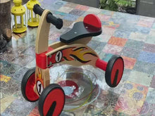 Load and play video in Gallery viewer, Ride on four wheeled wooden push bike on rubber wheels for toddlers.
