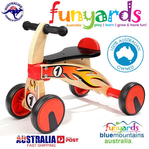 Ride on four wheeled wooden push bike on rubber wheels for toddlers.