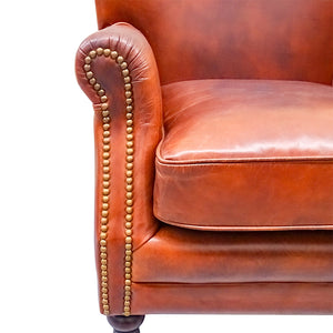 Traditional club style vintage leather armchair, a great eclectic piece.