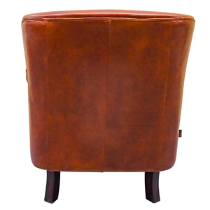 Traditional club style vintage leather armchair, a great eclectic piece.