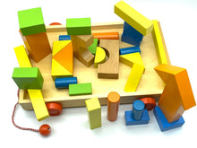 Load image into Gallery viewer, Wooden building puzzle blocks qty 33 in wood tray for toddlers with wheels and pull along handle
