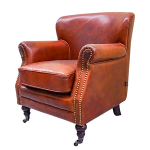 Traditional club style vintage leather armchair, a great eclectic piece.