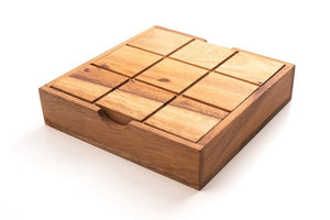 TIC TAC TOE naughts and Crosses board game on a wooden platform