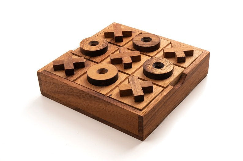 TIC TAC TOE naughts and Crosses board game on a wooden platform